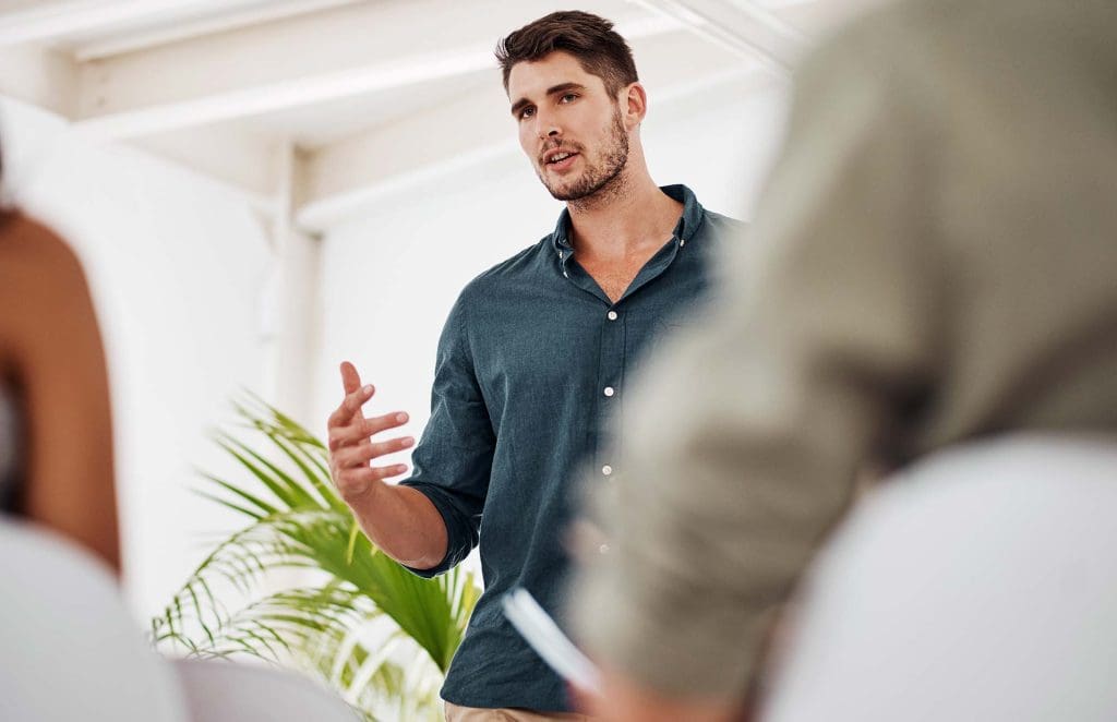 Team of professionals in a meeting around a conference table, brainstorming a project together.